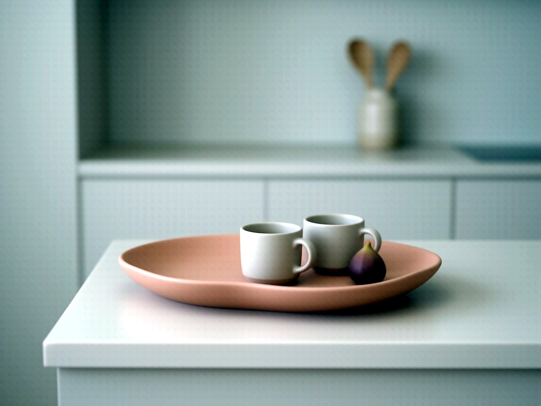 Terracotta shell tray with espresso cups on a kitchen counter
