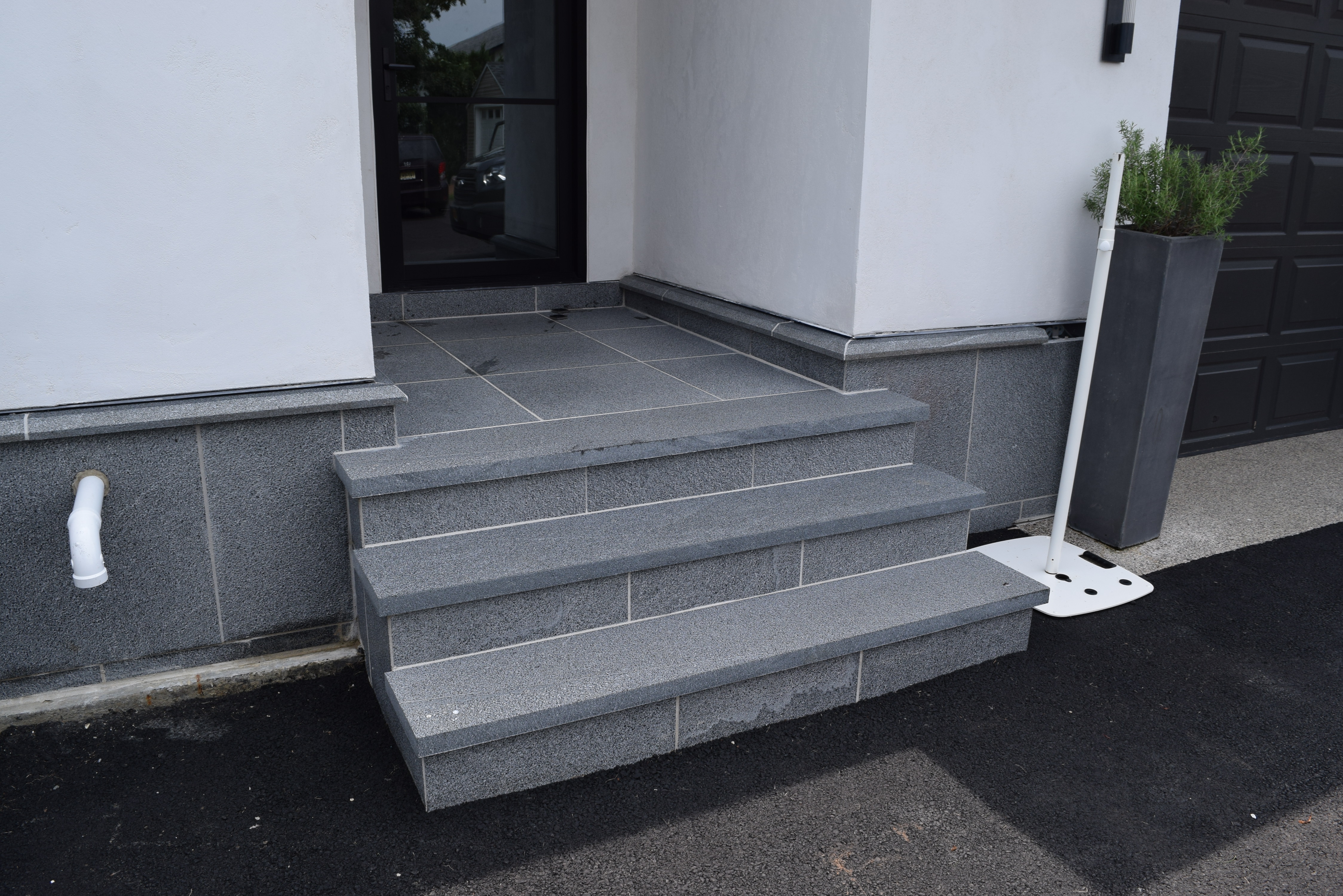 black moon sandblasted granite predominantly black with whit